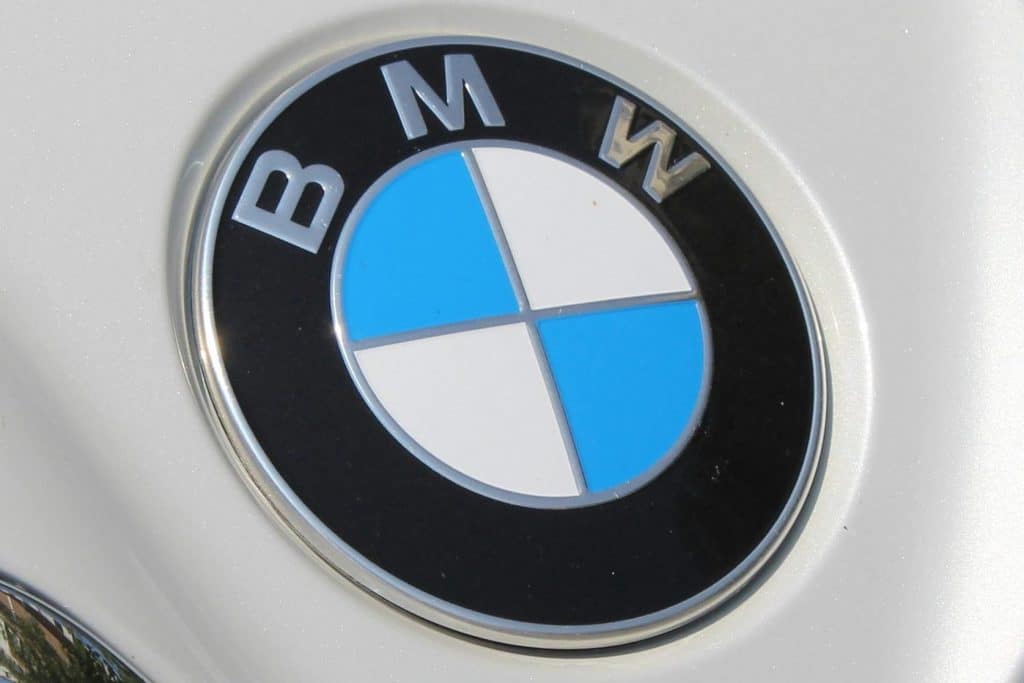pexels-photo-16764356-16764356 Detailed closeup of a BMW car grille and logo, showcasing chrome accents.