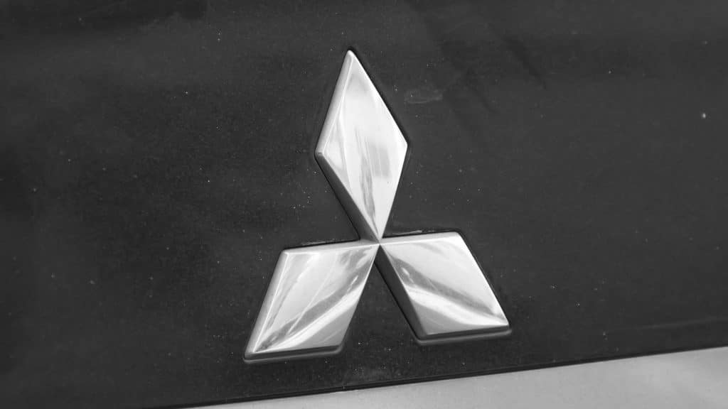 pexels-photo-17396046-17396046 Monochrome shot of an SUV emblem showcasing vehicle design elegance.
